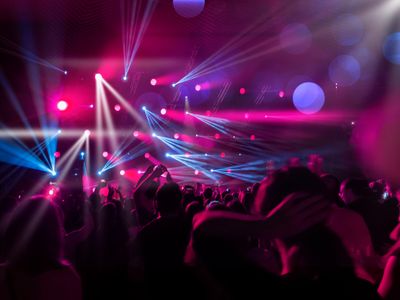 DJ performing with intelligent lighting effects