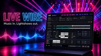Live Wire running on a laptop in front of a lit stage